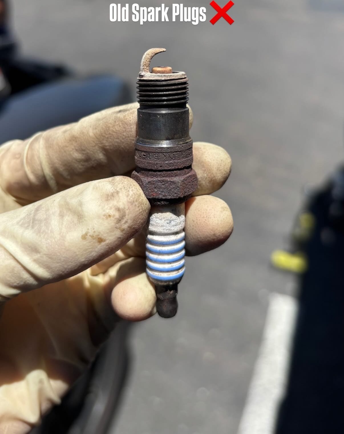 Old worn spark plug before replacement